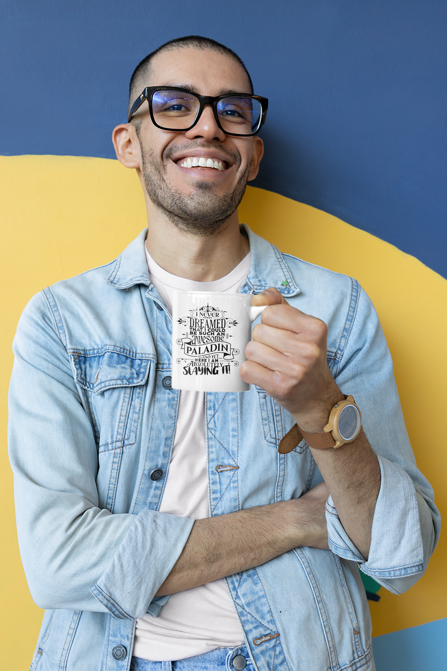 a man with glasses holding a cup of coffee