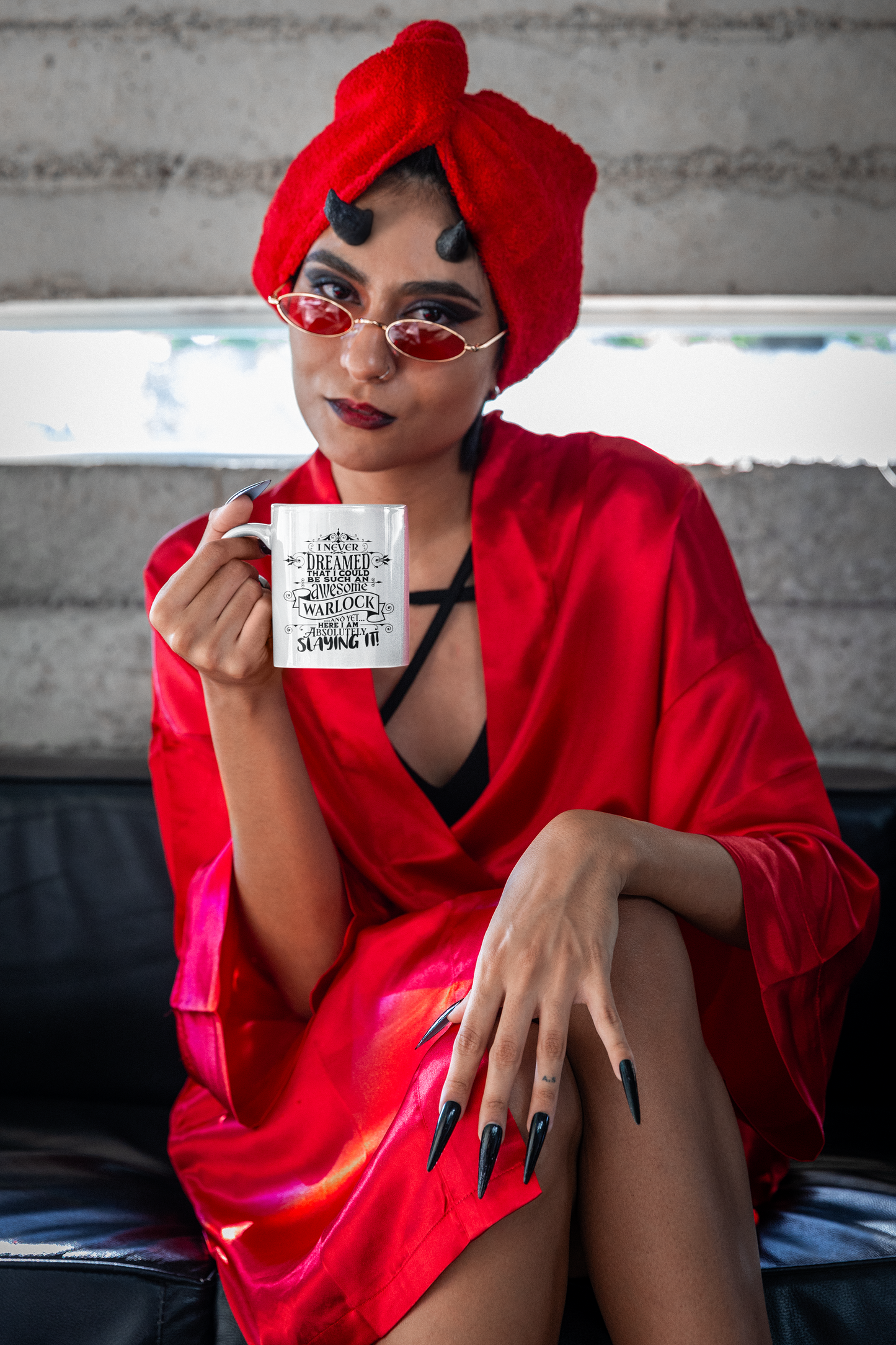 a woman in a red dress holding a coffee mug