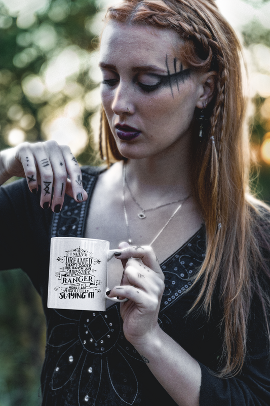 a woman holding a mug with writing on it