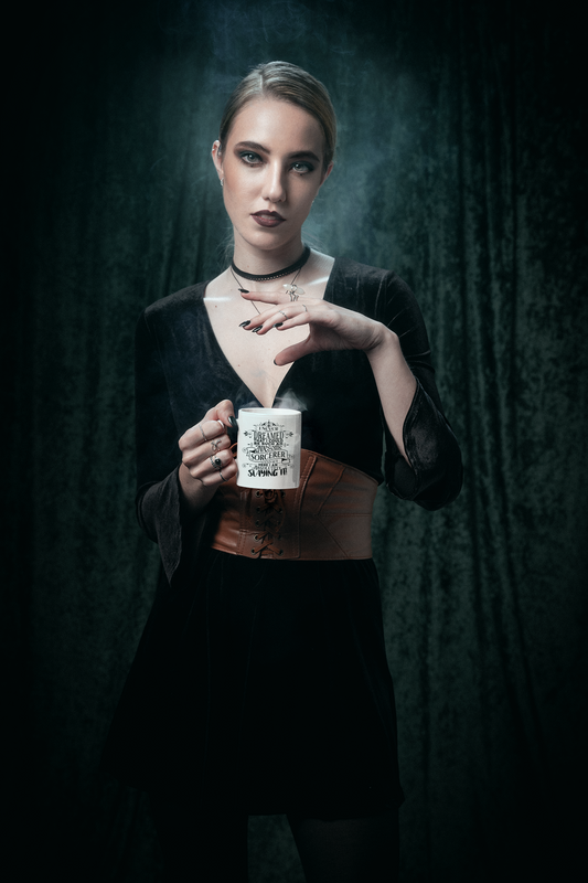 a woman holding a cup of coffee in her hands