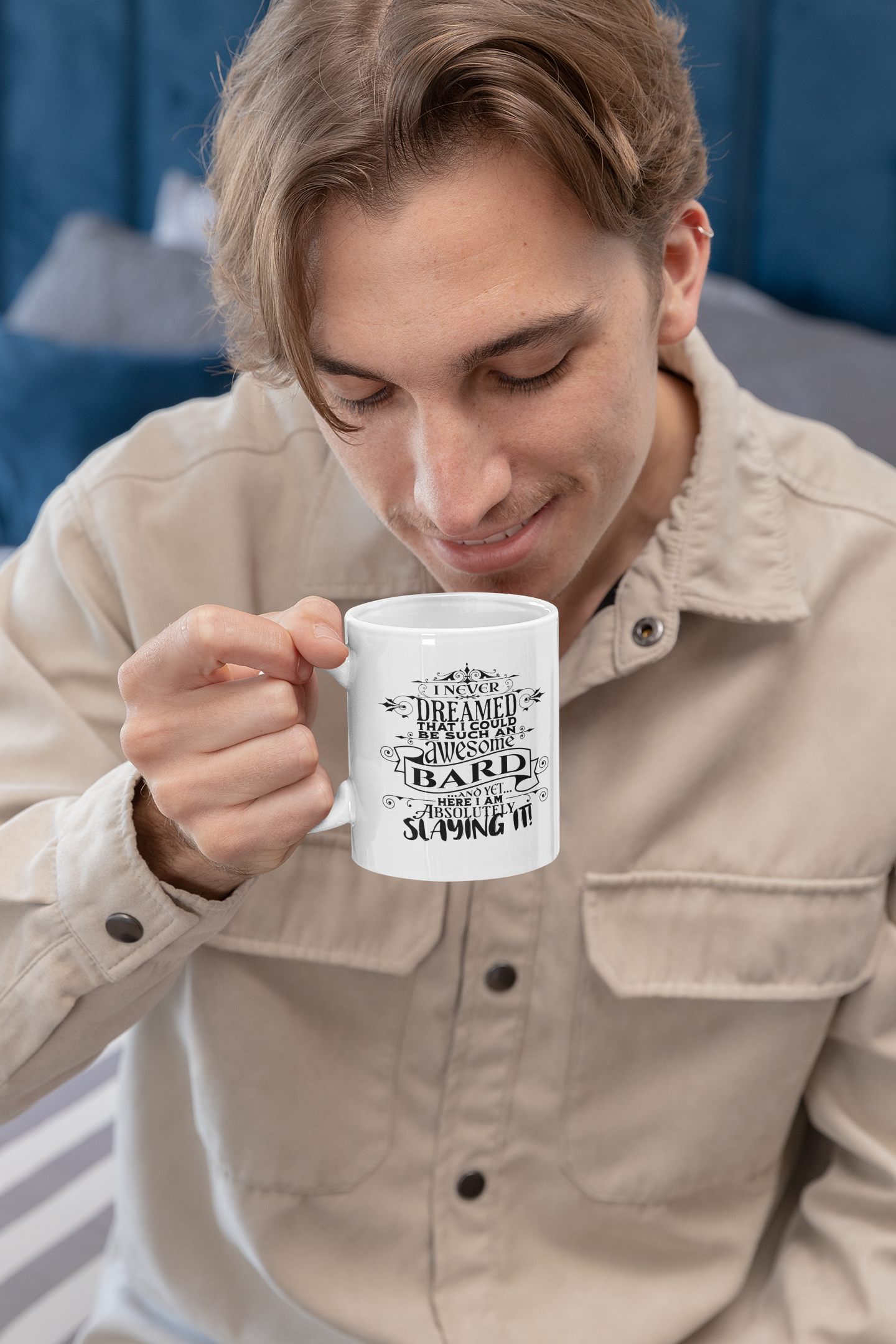 a man is holding a coffee mug in his hand