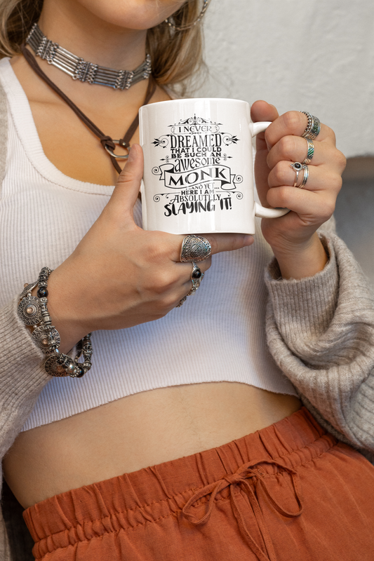 a woman is holding a coffee mug in her hands