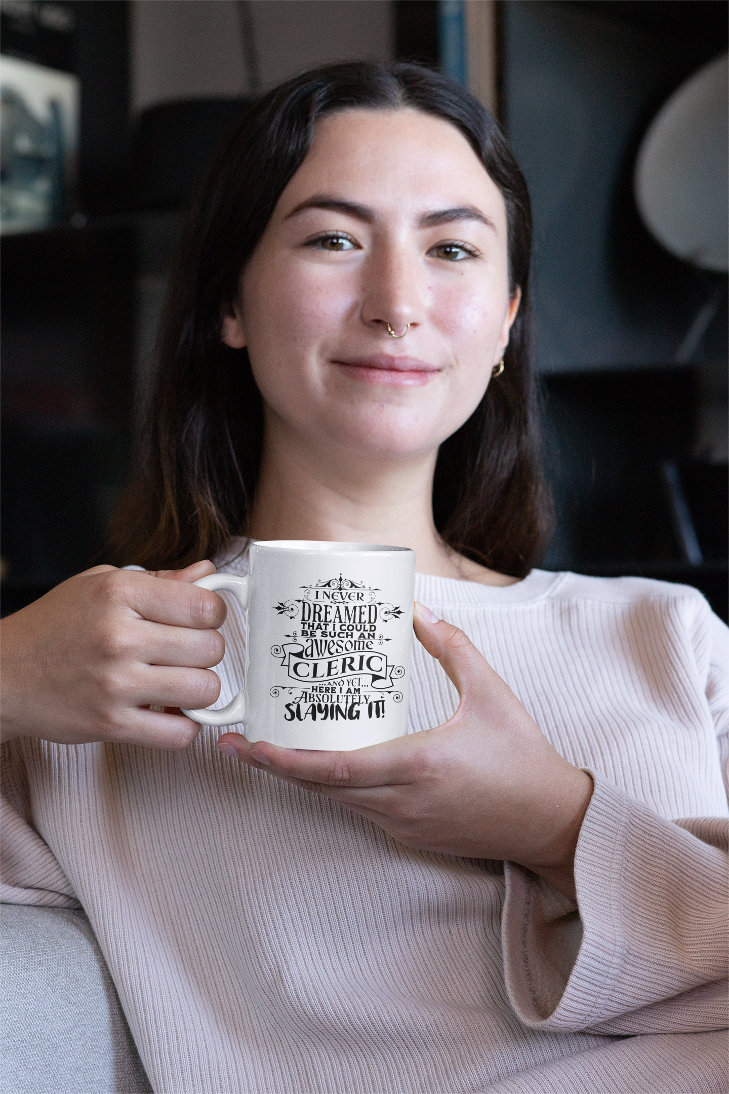 a woman holding a coffee mug in her hands